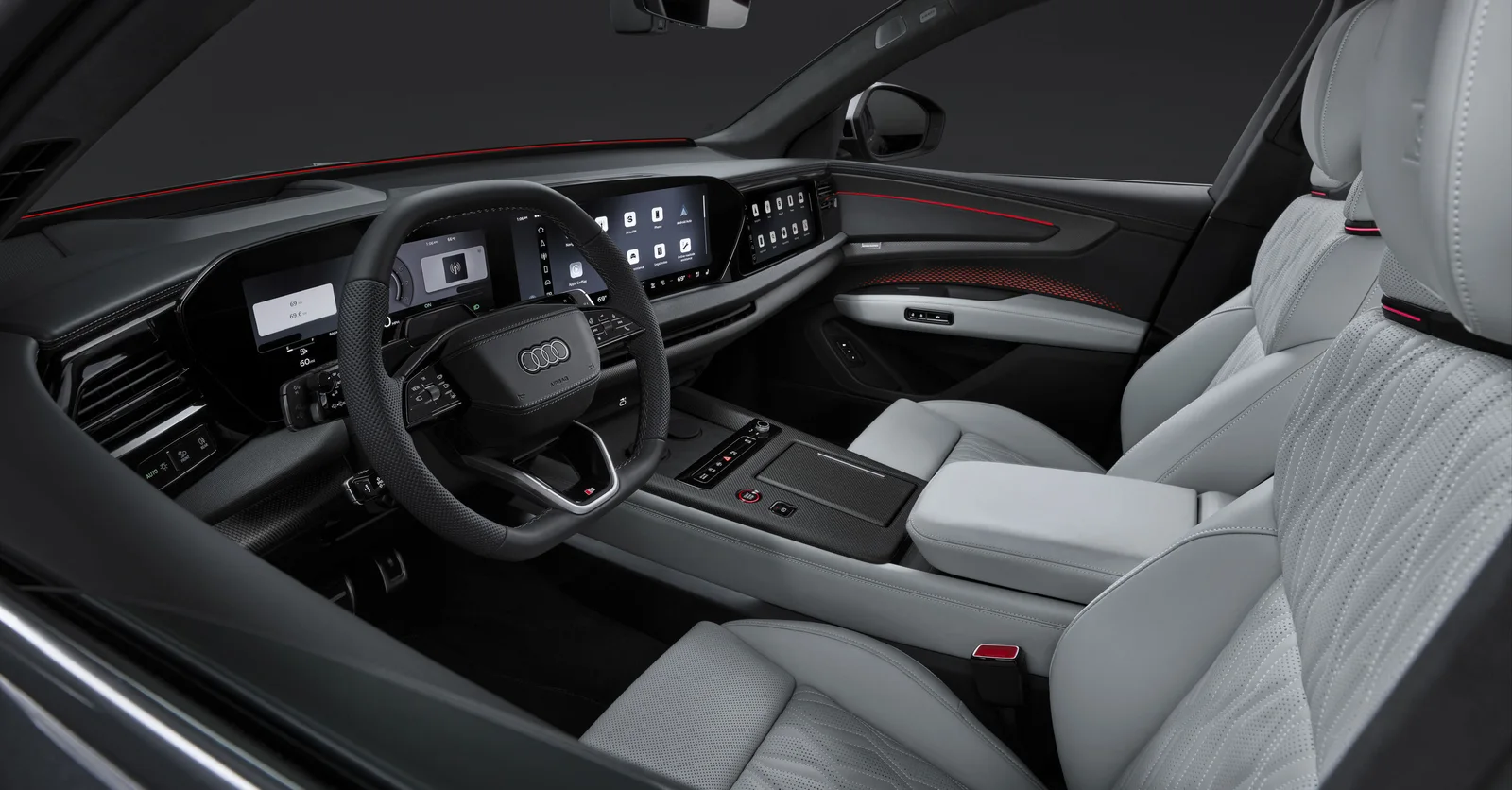 Vorschau: Innenraum des Audi Q9 mit hellen Sitzen und Cockpit